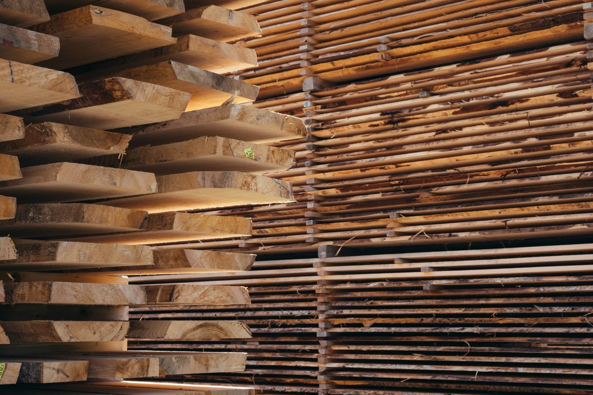 Stacked timber boards in the workshop showing premium real wood